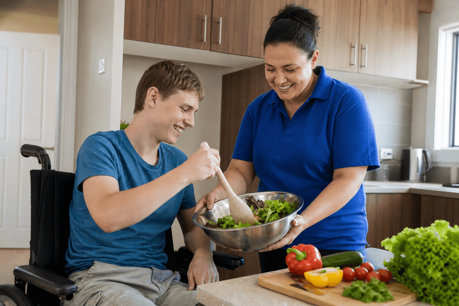 Support worker helping a participant prepare a meal in the kitchen